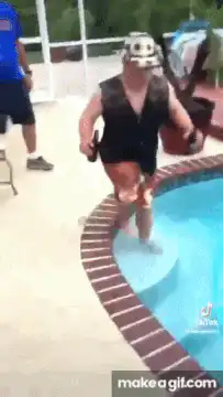 Man in pool with beer bottles