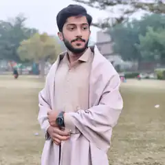 Man in shawl standing in park