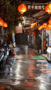 Rainy Kyoto street with lanterns