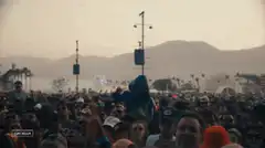 Person in blue hoodie crowd surfing