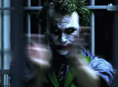 Joker clapping behind bars