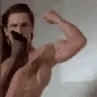 shirtless man flexing on phone