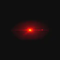 Red lens flare on black background