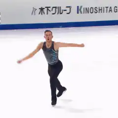Figure skater waves to crowd