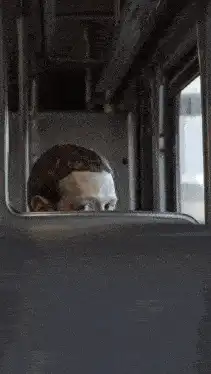 Mark Zuckerberg peeking on a train