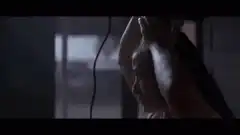 Woman Shaving Her Head with Clippers