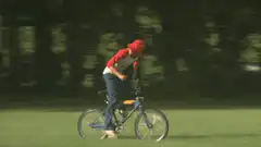 person riding a bike in a field