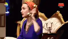 Woman on vintage phone looks shocked