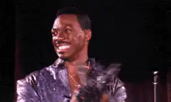 Eddie Murphy laughing on stage