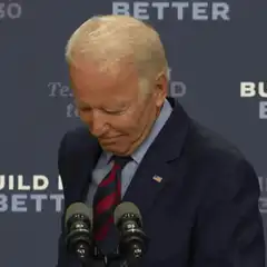Joe Biden rubs his eye at podium