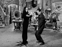 Morticia and Gomez Addams dance
