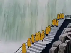 Monks in yellow robes on stairs