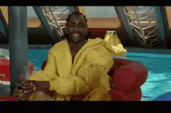 Lil Uzi Vert laughing in a yellow coat
