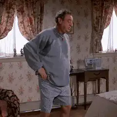 Old man rubbing his back in pain
