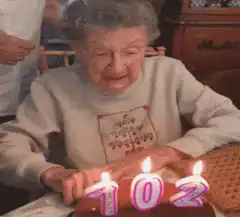 102 year old woman blows out candles
