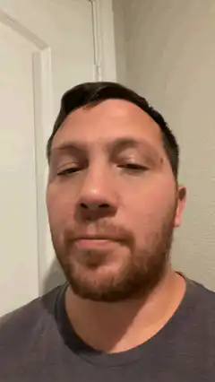 Man blinking and opening mouth