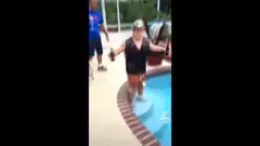 Woman dancing by pool