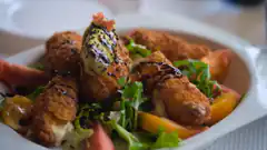 Fried mozzarella sticks with salad