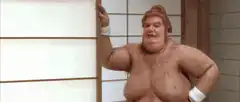 Sumo wrestler flexing chest