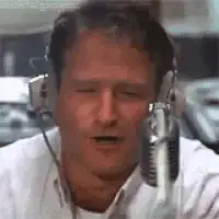 Robin Williams screaming into a microphone