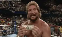 Dolph Ziggler holding a dollar bill