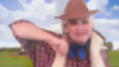 Woman in cowboy hat pointing
