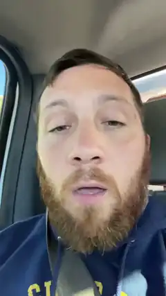 bearded man in car