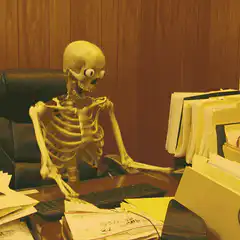 Skeleton typing at office desk