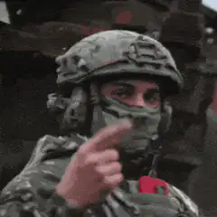 Soldier gives shaka sign