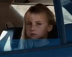 girl in car flips bird