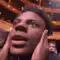 Man screaming with hands on head