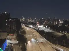 Nighttime city highway with light trails