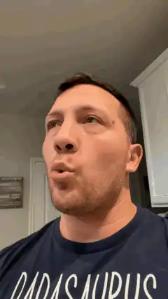 Man chewing with mouth open