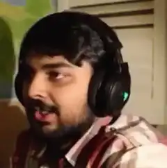 Man with headphones screaming excitedly