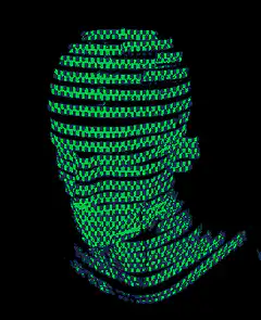green pixelated face on black background