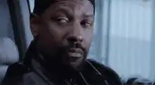 Denzel Washington smoking and nodding