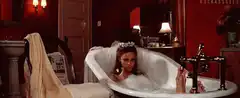 Vampire woman in bubble bath