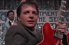 Marty McFly plays guitar on stage