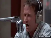 Robin Williams screaming into a microphone