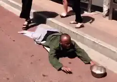 Homeless man crawls to bowl