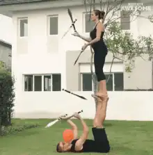 Acrobats juggling swords