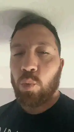 bearded man making faces