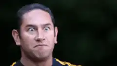 Man makes funny face and sticks out tongue