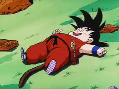 Baby Goku laughing on the ground