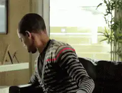 Man eating popcorn on couch