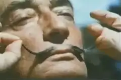Man stretching his mustache