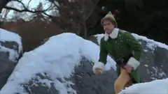 Buddy the Elf throwing snowballs