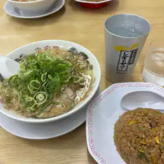Bowl of ramen with green onions and fried rice