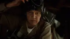 Pilot puts on goggles