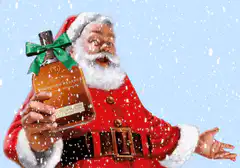 Santa Claus holding a bottle of whiskey in the snow